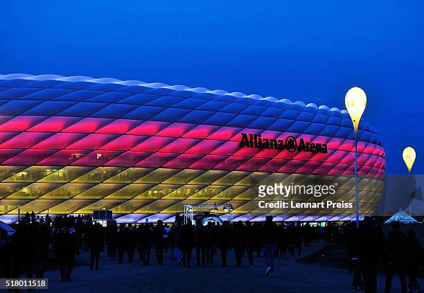 Fans arrive at Allianz Arena lit up in the colours of the German flag before the International Friendly match between Germany and Italy at Allianz...