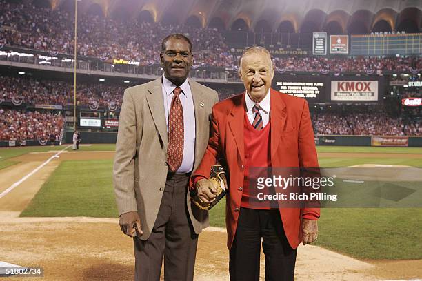 Bob Gibson and Stan Musial of the St. Louis Cardinals pose for a photograph prior to game three of the 2004 World Series against the Boston Red Sox...