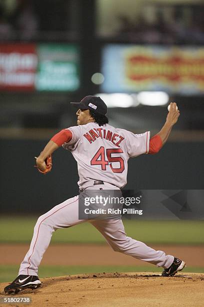 Pedro Martinez of the Boston Red Sox fields during game three of the 2004 World Series against the St. Louis Cardinals at Busch Stadium on October...