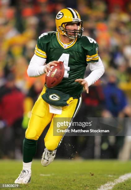 Quarterback Brett Favre of the Green Bay rolls out of the pocket against the St. Louis Rams November 29, 2004 at Lambeau Field in Green Bay,...