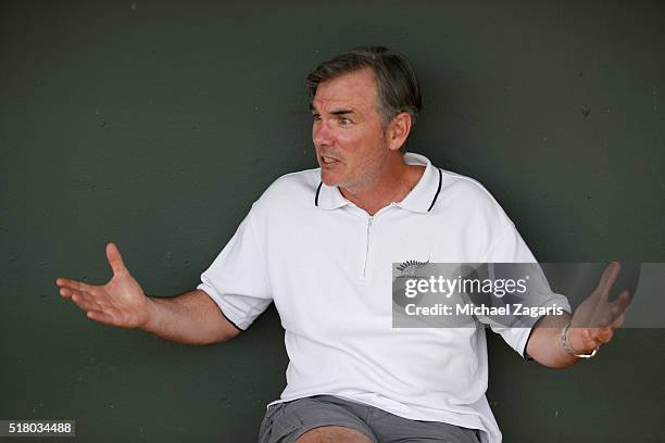 Executive Vice President of Baseball Operations Billy Beane of the Oakland Athletics relaxes in the dugout prior to a spring training game against...