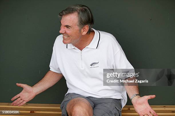 Executive Vice President of Baseball Operations Billy Beane of the Oakland Athletics relaxes in the dugout prior to a spring training game against...