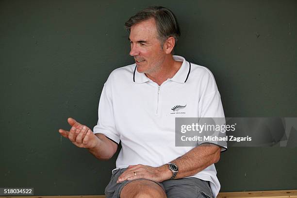 Executive Vice President of Baseball Operations Billy Beane of the Oakland Athletics relaxes in the dugout prior to a spring training game against...