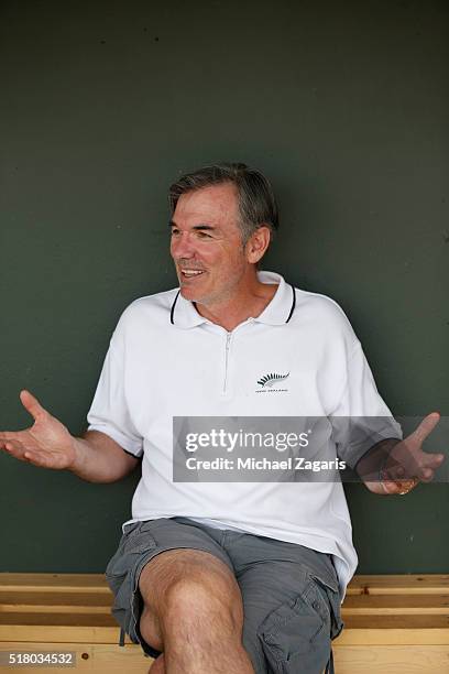 Executive Vice President of Baseball Operations Billy Beane of the Oakland Athletics relaxes in the dugout prior to a spring training game against...
