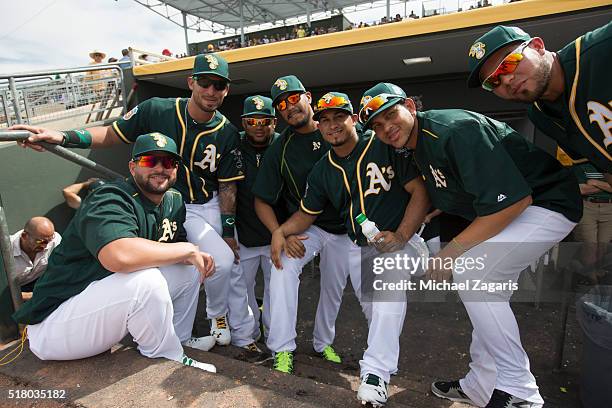 Yonder Alonso, Rangel Ravelo, Angel Castro, Felix Doubront, Franklin Barreto, Henderson Alvarez and Renato Nunez of the Oakland Athletics relax in...