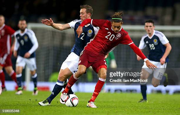 Steven Whittaker of Scotland vies with Jonas loss of Denmark during the International Friendly match between Scotland and Denmark at Hampden Park on...