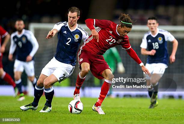 Steven Whittaker of Scotland vies with Jonas loss of Denmark during the International Friendly match between Scotland and Denmark at Hampden Park on...