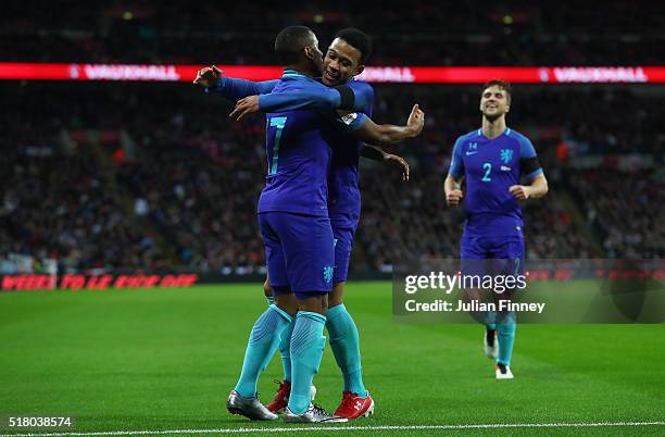 Luciano Narsingh of the Netherlands celebrates scoring his sides second goal with Memphis Depay during the International Friendly match between...