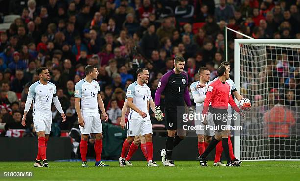 England players argue with referee Antonio Miguel Mateu Lahoz after the second Netherlands goal scored by Luciano Narsingh during the International...