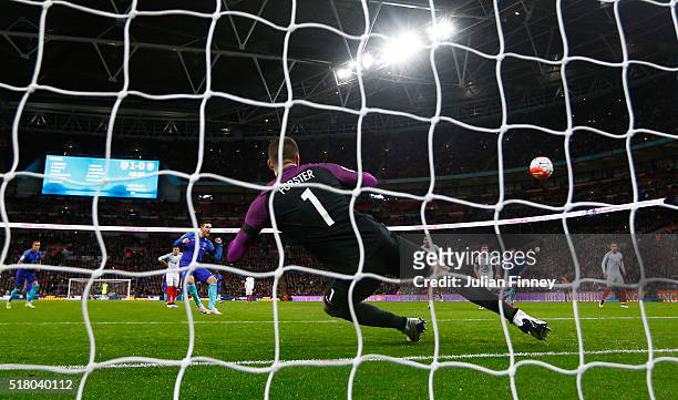 Vincent Janssen of the Netherlands scores the equalising goal from a penalty past Fraser Forster goalkeeper of England during the International...