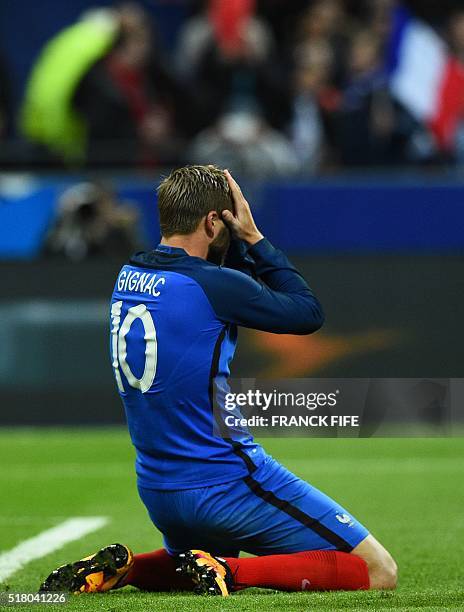 France's forward Andre-Pierre Gignac reacts during the international friendly football match between France and Russia at the Stade de France in...