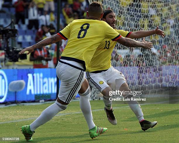 Sebastian Perez of Colombia celebrates with teammate Edwin Cardona after scoring the second goal of his team during a match between Colombia and...