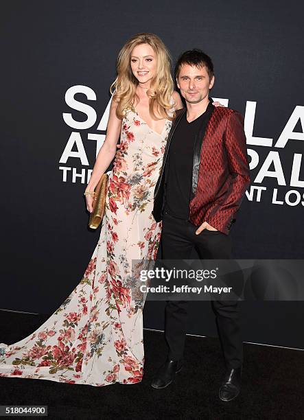 Model Elle Evans and musician Matt Bellamy attend the Saint Laurent show at The Hollywood Palladium on February 10, 2016 in Los Angeles, California.