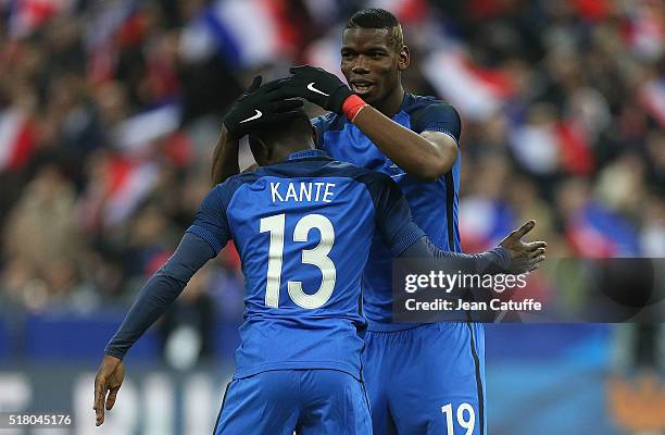 Golo Kante of France celebrates his goal with Paul Pogba of France during the international friendly match between France and Russia at Stade de...