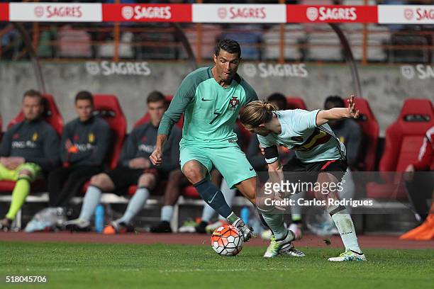 Portuguese forward Cristiano Ronaldo vies with Belgium midfielder Guillaume Gillet during the match between Portugal and Belgium Friendly...