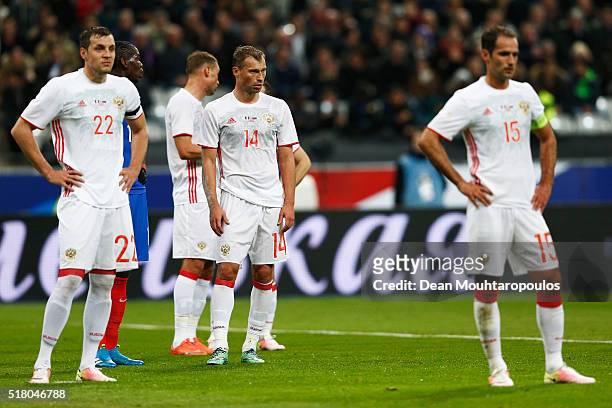 Artem Dzyuba, Vasily Berezutski and Roman Shirokov of Russia look on during the International Friendly match between France and Russia held at Stade...