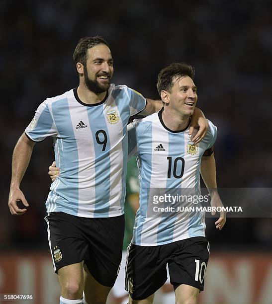 Argentina's Gonzalo Higuain and Lionel Messi celebrate after teammate Gabriel Mercado scored against Bolivia during their Russia 2018 FIFA World Cup...