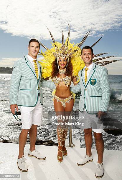 Australian athletes Ed Jenkins and Jamie Dwyer pose with a Brazilian dancer during the Australian Olympic Games Opening Ceremony Uniform Official...