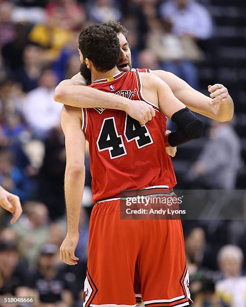 Pau Gasol hugs Nikola Mirotic of the Chicago Bulls after Mirotic made a three point shot during the game against the Indiana Pacers at Bankers Life...