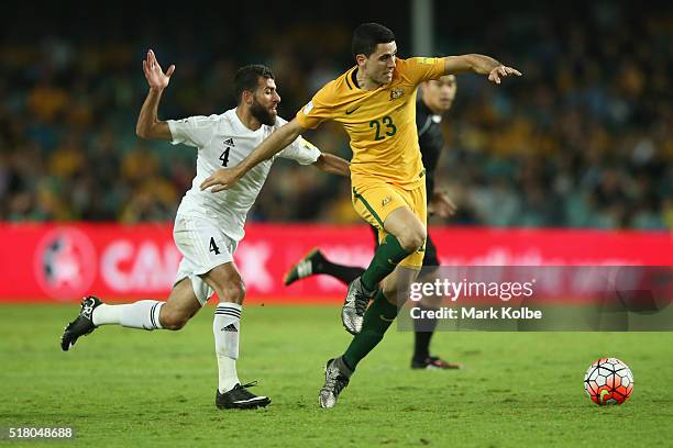 Bahaa Abdelrahman of Jordan and Thomas Rogic of Australia contest the ball during the 2018 FIFA World Cup Qualification match between the Australian...