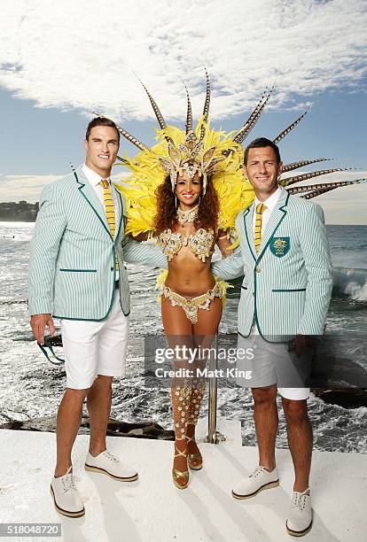 Australian athletes Ed Jenkins and Jamie Dwyer pose with a Brazilian dancer during the Australian Olympic Games Opening Ceremony Uniform Official...