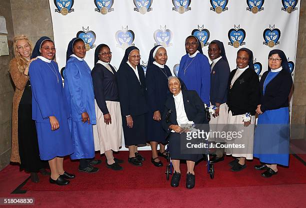 Wendy Oxenhorn and members of the Franciscan Handmaids Of The Most Pure Heart of Mary pose for a photo at the 2016 Franciscan Handmaids Of The Most...