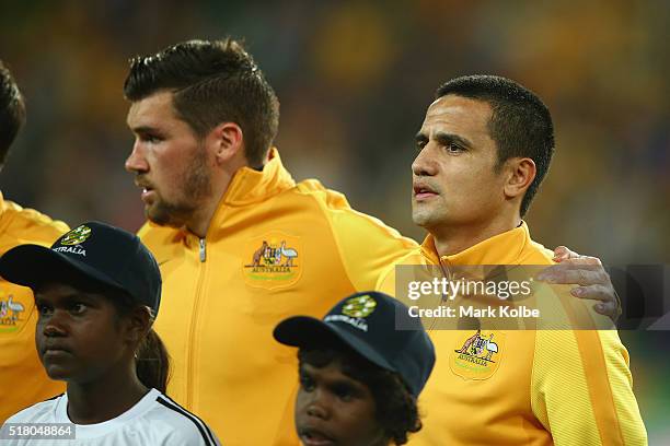 Mathew Ryan and Tim Cahill of Australia sing the national anthem before the 2018 FIFA World Cup Qualification match between the Australian Socceroos...