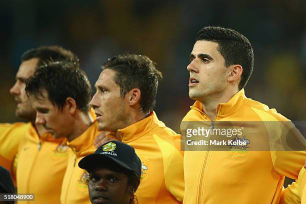 Thomas Rogic of Australia sings the national anthem before the 2018 FIFA World Cup Qualification match between the Australian Socceroos and Jordan at...