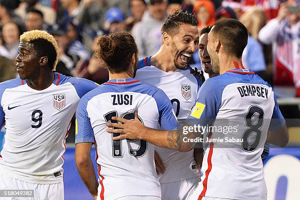 Geoff Cameron of the United States Men's National Team celebrates his first half goal against Guatemala with Graham Zusi of the United States Men's...