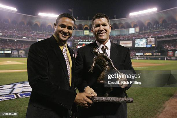 Edgar Martinez of the Seattle Mariners recieves the Roberto Clemente Award from Roberto Clemente Jr. Prior to game three of the 2004 World Series...