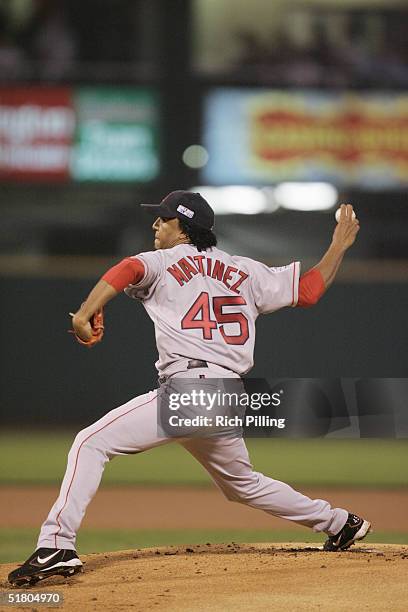 Pedro Martinez of the Boston Red Sox fields during game three of the 2004 World Series against the St. Louis Cardinals at Busch Stadium on October...