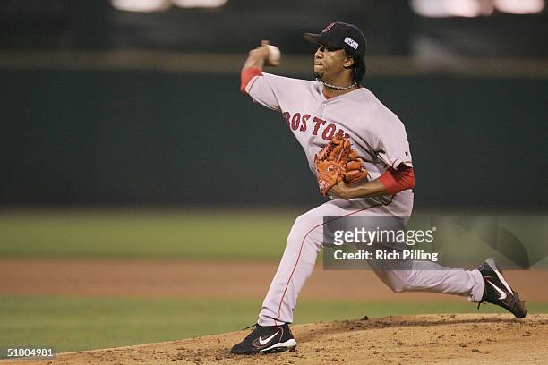 Pedro Martinez of the Boston Red Sox pitches during game three of the 2004 World Series against the St. Louis Cardinals at Busch Stadium on October...