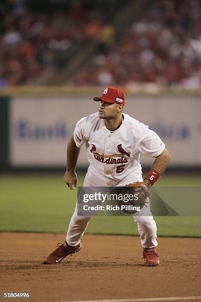 Albert Pujols of the St. Louis Cardinals fields during game three of the 2004 World Series against the Boston Red Sox at Busch Stadium on October 26,...