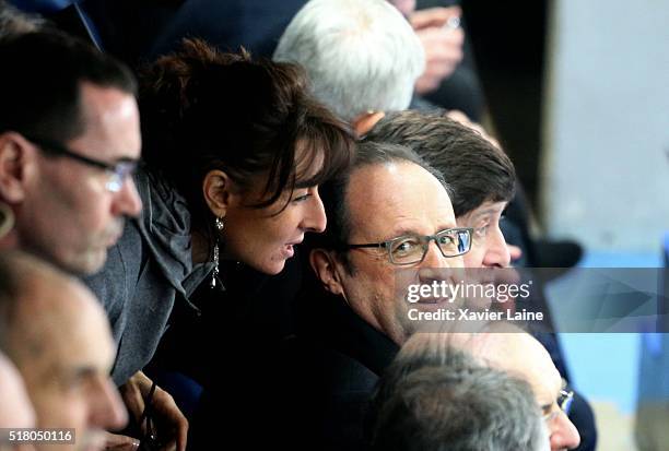 Nathalie Iannetta and President Francois Hollande react during the International Friendly games between France and Russia at Stade de France on March...