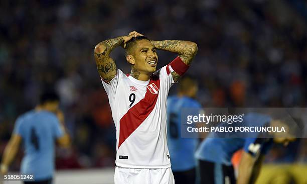 Peru's Paolo Guerrero gestures during the Russia 2018 FIFA World Cup South American Qualifiers' football match against Uruguay at the Centenario...