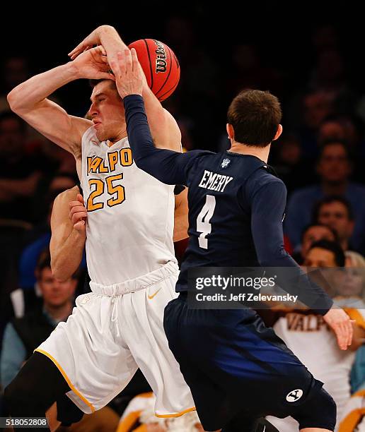 Nick Emery of the Brigham Young Cougars guards Alec Peters of the Valparaiso Crusaders during their NIT Championship Semifinal game at Madison Square...