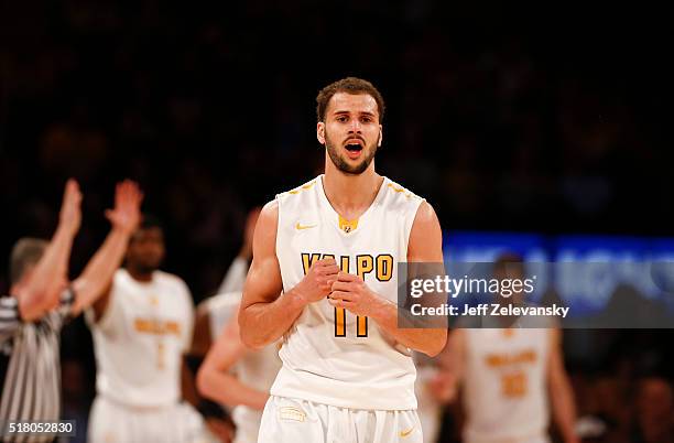 Shane Hamming of the Valparaiso Crusaders reacts to sinking a three-point shot against the Brigham Young Cougars during their NIT Championship...