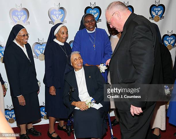His Eminence Cardinal Timothy Michael Cardinal Dolan speaks with members of the Franciscan Handmaids Of The Most Pure Heart of Mary at the 2016...