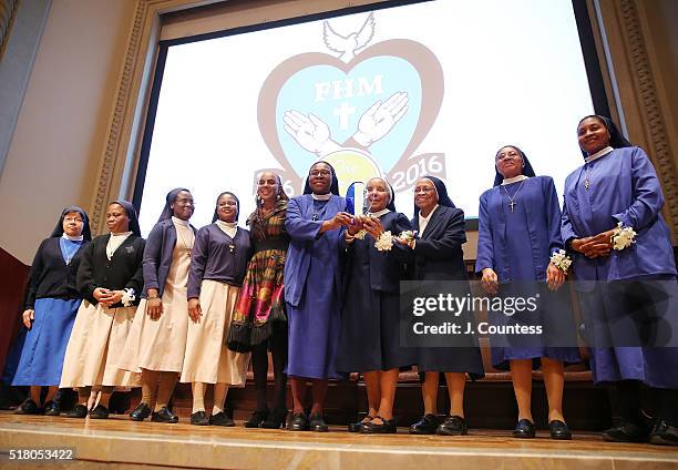 Editor and Chief Emerita Susan Taylor joins members of the Franciscan Handmaids Of The Most Pure Heart of Mary onstage for a photo during the 2016...