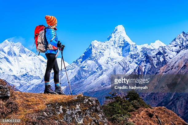 young woman looking at ama dablam, mount everest national park - nepal stock pictures, royalty-free photos & images