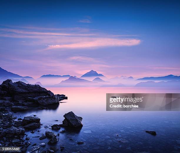 sunset on a rocky beach - seascape stock pictures, royalty-free photos & images