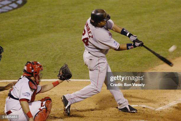 Manny Ramirez of the Boston Red Sox bats during game four of the 2004 World Series against the St. Louis Cardinals at Busch Stadium on October 27,...