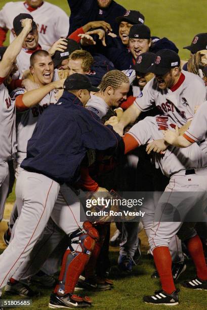 The Boston Red Sox celebrate after winning game four of the 2004 World Series against the St. Louis Cardinals at Busch Stadium on October 27, 2004 in...