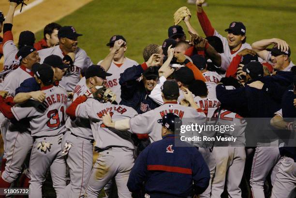 The Boston Red Sox celebrate after winning game four of the 2004 World Series against the St. Louis Cardinals at Busch Stadium on October 27, 2004 in...