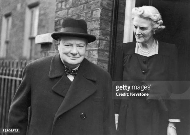 On his 71st birthday, former British Prime Minister Winston Churchill and his wife Clementine leave their home at Hyde Park Gate, to attend a commons...