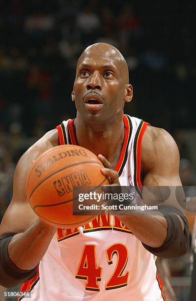 Kevin Willis of the Atlanta Hawks shoots a free throw against the San Antonio Spurs during the game on November 13, 2004 at Philips Arena in Atlanta,...