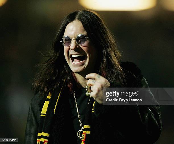 Ozzy Osbourne has a laughduring the Carling Cup Quarter final match between Watford and Portsmouth at Vicarage Road on November 30, 2004 in Watford,...