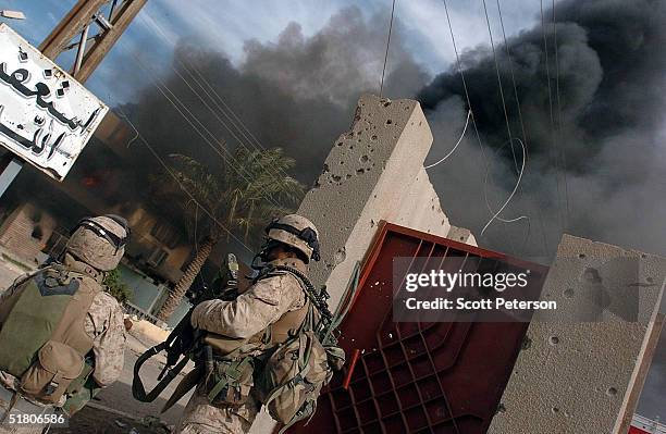 Marines of the 1st Battalion 3rd Marines battle with three insurgents while searching a house, leaving three insurgents, one marine dead and marines...