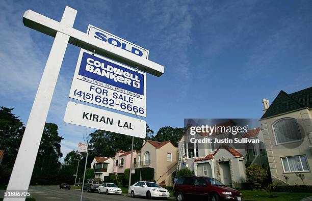 For Sale" sign with another "Sold" sign on top of it is seen in front of a home November 30, 2004 in San Francisco, California. The average U.S....