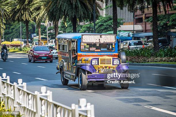 jeepney in makati city, manila, philippines. - philippines jeepney stock pictures, royalty-free photos & images